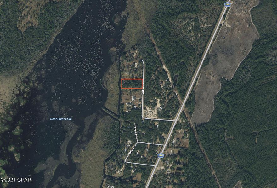 Over 1 acre lot with possible access to Deer Point Lake on a paved road.