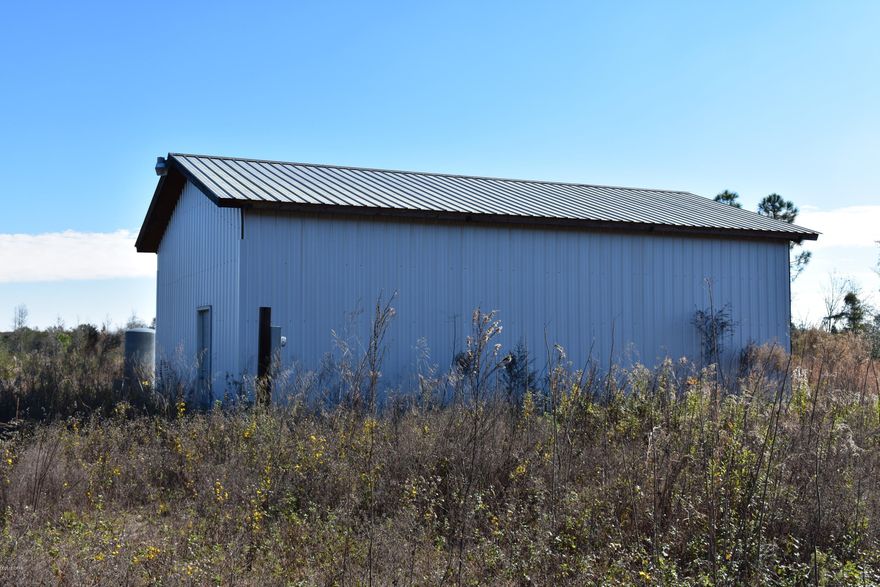 This is a beautiful mostly cleared 40 acre piece of property with a septic, well, 24x36 metal shop building with 1/2 bath, ready to build your home on. Also has a hand pump well on NE section of property.  Would be great for horses or cattle as well.