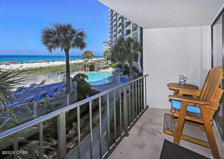 Stunning remodel - Thoughtful upgrades - Inspired Gulf-front living! You will love the popular easy care porcelain wood-look tile flooring that greets you. Stylish kitchen upgrades include gorgeous quartz counters, ship lap accents, backsplash, stainless appliances. The spacious master has it's own bathroom with beautiful double vanity, backsplash, modern mirrors and lighting, large tile shower. The same design is repeated in the pretty guest bathroom. The guest bedroom has a view over to the onsite golf course. New furniture and fixtures, pretty decor. Relax on the private balcony full of coastal breezes, gorgeous beach scenes and breathtaking sunsets. This condo is furnished and ready to earn rental income to pay ownership expenses. Exclusive amenities include tropical lagoon pool, heated pools, hot tubs, sun decks, Bar, Restaurant, Market. The Club offers a Par 3 Golf Course, Tennis, Basketball, Shuffleboard, Fitness Center. Kids Club. Owner's pets welcome! Gated entrances. RV, Boat, Trailer, Electric Car parking. Walkable to dining, shopping, entertainment. On trolley line to Pier Park!