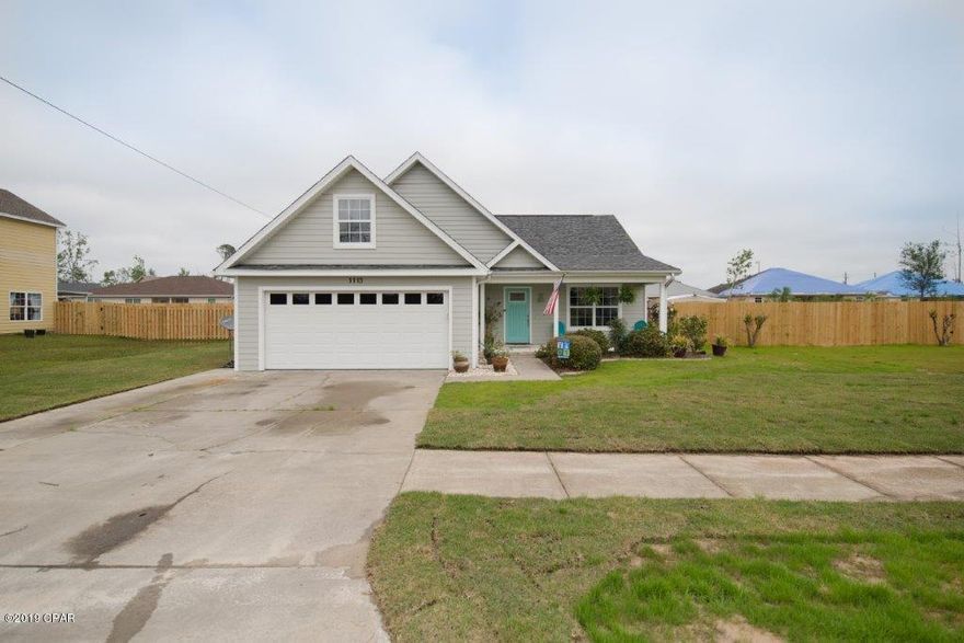 ''CURRENTLY UNDER CONTRACT, SELLER ACCEPTING BACKUP OFFERS''. NEW ROOF, NEW EXTERIOR and INTERIOR PAINT, NEW PRIVACY FENCE, CUSTOM DESIGNED KITCHEN, IN-GROUND SALT WATER POOL, NEW LUXURY PLANK VINYL FLOORING installed throughout the majority of the home. This beautiful home is located in the very desirable city of Lynn Haven. The new owners will love the open living room, with its cathedral ceiling and arched opening looking into the dining room. A cooks dream is the best way to describe the gorgeous custom designed kitchen with glass tile back splash, granite countertops, under cabinet lighting, cabinets with glass accent doors, draws with sliding shelves and a five burner gas stove.. The adjacent laundry room has also been custom designed with a stackable washer/dryer, folding table and pantry. French doors separate the home office and a playroom/craft room is just down the hallway. The master suite is very spacious with a walk-in closet and the master bathroom offers a double vanity, garden tub and a beautiful, newly tiled shower. An additional bedroom and full bath, with a tub/shower combo are all located on the first floor living area. A third bedroom is located on the second level above the garage and offers complete privacy. If you enjoy backyard entertaining, this home is for you! A sparkling 16,000 gallon saltwater pool and covered patio is perfect for summer cookouts and fun in the sun. Need a place to store your lawn and garden equipment? No worries, there's a large yard barn that's complete with an attached outside bar and includes electricity on the front and back sides of the barn. Do you have a boat or RV? If so, there's a concrete pad and plenty of room to store it in the large gated back yard. Make an appointment to see this outstanding home today!