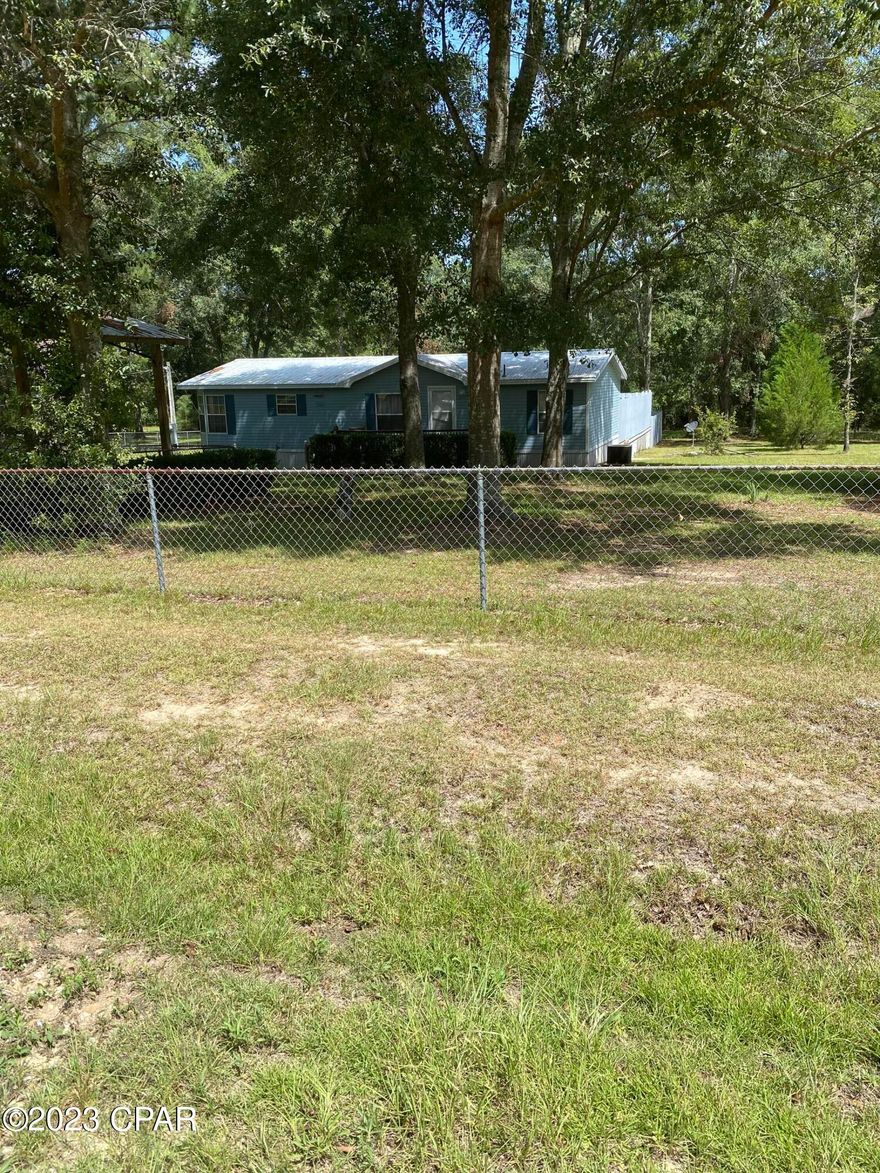 CURRENTLY UNDER CONTRACT. SELLER WILL CONSIDER BACKUP OFFERS. HOME WITH ACREAGE! If you like quiet country living, this home is for you! Situated on 6.4 acres this immaculate 2 bedroom, 2 bath home with above ground pool is move in ready! Quiet and secluded with abundant wildlife.  Privacy fence around part of the home and pool. Home features large living area and dining area with functional kitchen and a split floor plan featuring large Master and bathroom. The second bedroom is also spacious with another bathroom. Outside the  pool area has deck around it. Home has been very well maintained.
Home is on well and septic. Pole barn outside for storage. Call today to see this one!