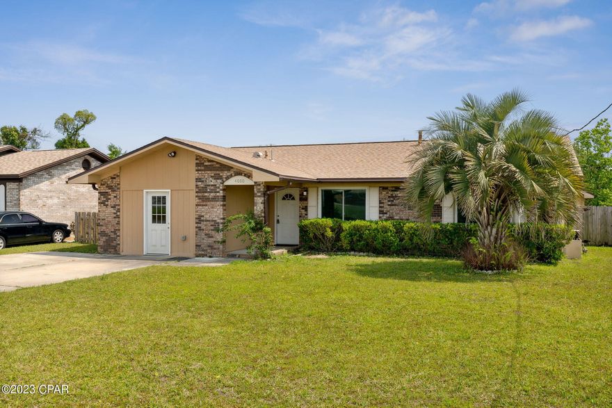 Under contract - Seller will consider back up offers. Welcome to 4000 E 14th Street, a charming three-bedroom, two-bathroom home nestled in the heart of Panama City. This delightful home offers a comfortable and spacious living environment, with an array of features that ensure both relaxation and convenience.

Upon entering, you'll be greeted by a warm and inviting ambiance that extends throughout the entire property. The layout of this home is designed to accommodate various lifestyles, providing two distinct living areas for your needs. The family room stands as a focal point, boasting a captivating wood-burning fireplace that sets the perfect tone for cozy evenings with loved ones.

The kitchen features elegant granite countertops and modern stainless-steel appliances. Whether you're a culinary enthusiast or simply enjoy cooking for your family, this kitchen offers the ideal space to prepare meals and create lasting memories. The seamless flow between the kitchen and living area makes entertaining a breeze.

Stepping outside, you'll discover leisure and relaxation in your own backyard. A delightful surprise awaits in the form of a small, inviting pool - a private oasis where you can unwind and escape the summer heat. Additionally, a spacious workshop at the rear of the property to provide ample storage space.

Noteworthy inclusions are the solar panels discreetly located on the back of the roof. These will  play a role in alleviating those summertime power bills. The seller's generosity extends to covering the solar panel expenses, ensuring a smooth transition and additional savings for you as the new homeowner. There are also new windows in the home.

This property boasts a great location, conveniently situated near shopping centers, Tyndall Air Force Base, and an array of water recreational opportunities. From tranquil bays to scenic lakes and pristine beaches, you'll have a plethora of options to explore and enjoy. It has been recently painted and the garage has been enclosed for extra storage room (not heated and cooled and not include in the square footage).

In summary, this home offers a harmonious blend of comfort, style, and functionality. With its multiple living spaces, cozy fireplace, upscale kitchen, refreshing pool, and the added benefit of solar panels, this home provides everything you need for a fulfilling and convenient lifestyle in the heart of Panama City.