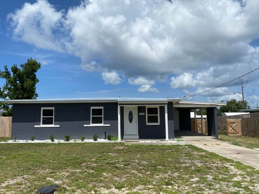 Totally updated home in Forest Park.  This concrete block home was just gutted to the studs and everything is new.  Tile floors throughout, butcher block counter tops, stainless steel appliances and so much more.  New metal roof, new windows, new electrical, new plumbing and new septic system.  Home sits on large lot with fenced in back yard.  There is an attached carport and large back deck.  Call to see today.