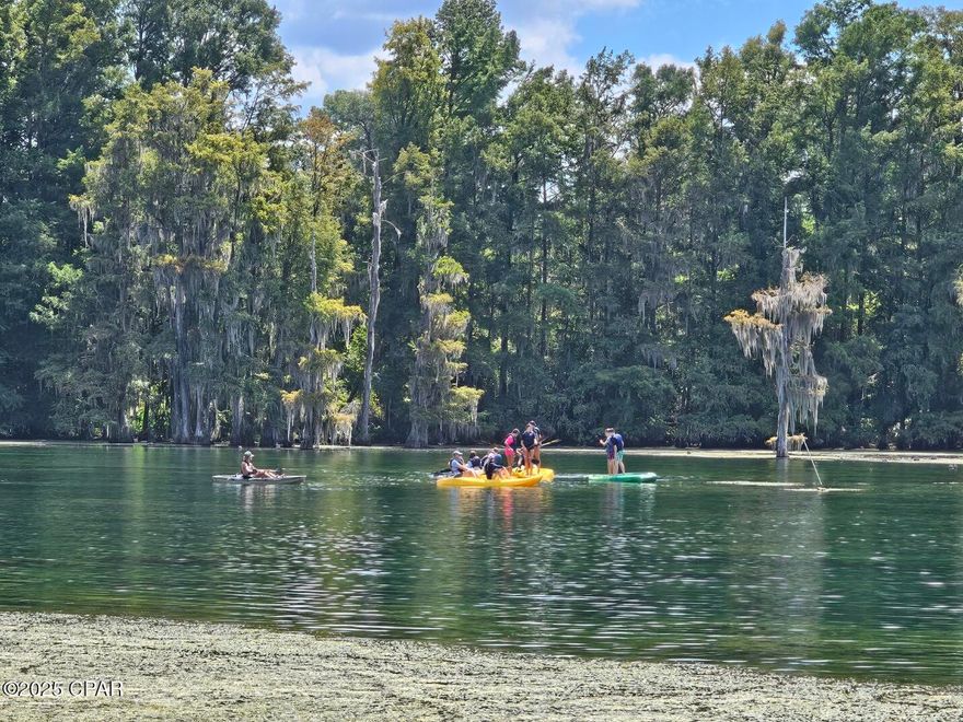 This purchase includes not one but TWO lots on Merritt's Mill Pond approximately 1.88 +/- acres.  The lot features a concrete driveway all the way down to the pond where there is a concrete parking pad and a huge partially covered dock.  There is a covered boat slip that was damaged in the last storm that came through and is in need of repair. There are two home located on these lots that are in need of repair or be removed and build your dream home.  The DW is in decent shape and could be made into a nice home with a little TLC. Please beware that there is mold in both homes.  Please take precautions.