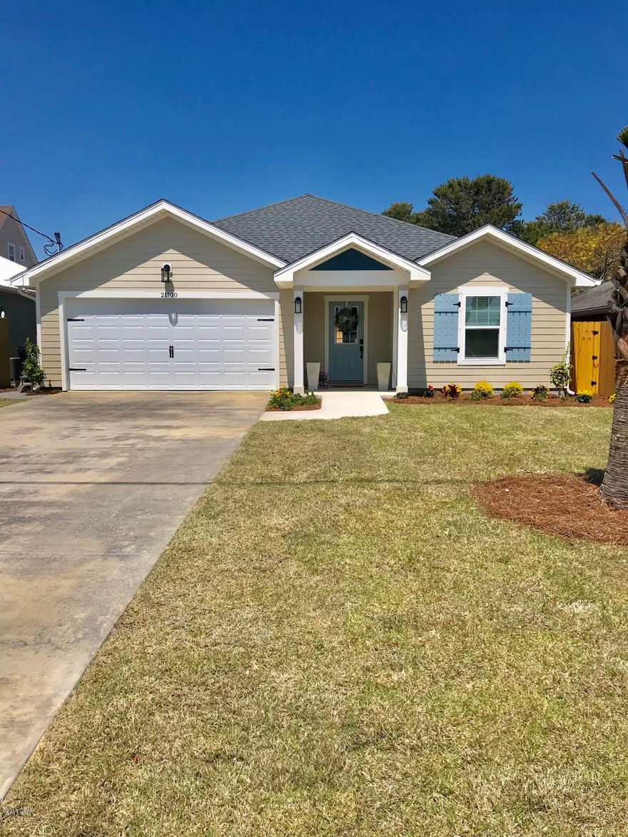 This single story 3 bedroom/3 bath home is a jewel! Three-tenths of a mile to the beach, and features: granite counter tops & subway tile backsplash, stainless steel appliances, shaker style white 42'' cabinets, great room with vaulted ceiling, breakfast bar, heated pool with waterfall and paver surround, easy care wood-look tile wood-look flooring, large tiled MBath shower, Hardi Board exterior, crown molding through out, irrigation system, fenced back yard, 2-car garage with painted floor and shelving, and sodded yard.