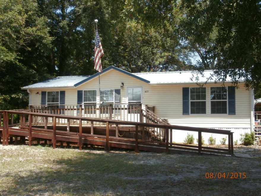 3 bed/2 bath doublewide 48x28 mobile home on private lot. All electric. Comes with Stove, fridge with icemaker, dishwasher, microwave, disposal. Washer and Dryer. Small dog ok, under 25 pounds. $250 pet deposit. Sorry, no cats. Yard is chain link fenced. One car carport