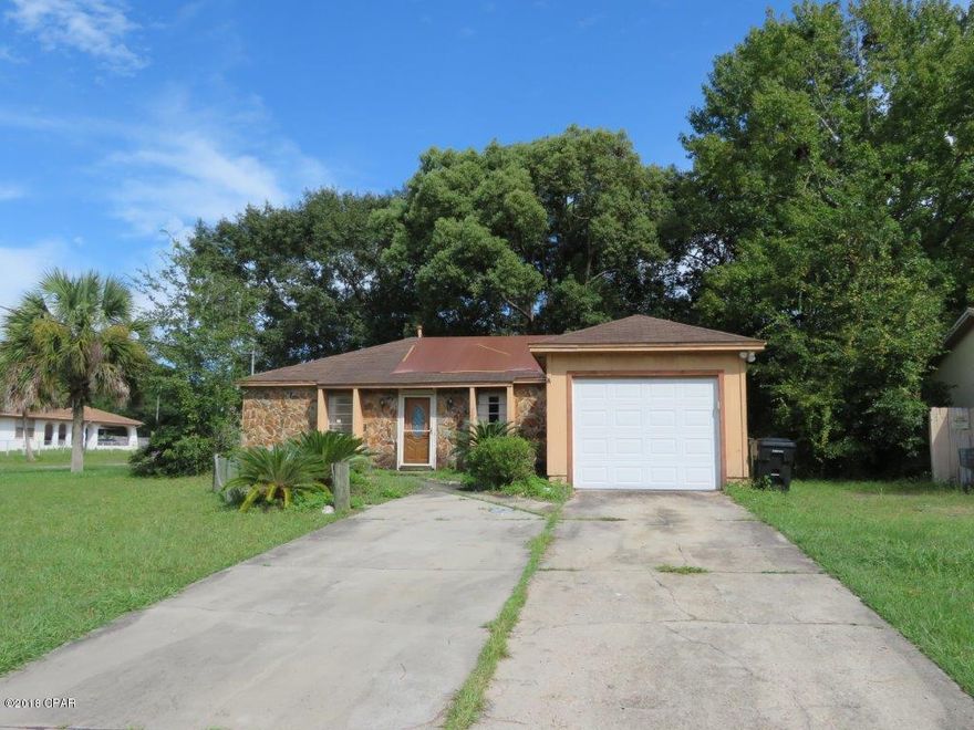 Spacious ranch located on large level corner lot! Open living room with vaulted ceilings and sliding doors leading to covered patio! Separate dining area! Kitchen boasts stained cabinets, laminate counter tops, and large pantry area! Master bedroom has walk in close and private en suite. Two secondary bedrooms share a full bath! Fenced back yard! Covered patio, perfect for entertaining! Don't miss out, show and submit your offer today!