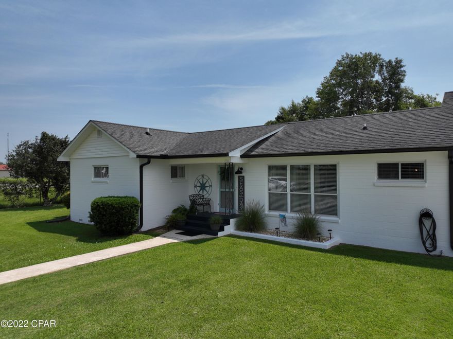 LOOK NO FARTHER ... Here is your FLORIDA COTTAGE nestled near THE GULF of Mexico. Approximately 45 minutes to the beaches this can be your get-a-way vacation home or primary residence. This updated 3bed 2bath is perfect for anyone looking for low maintenance  and convenience. New HVAC added June 2022 , updated baths and hardwoods throughout are a few of the many upgrades.  The Apalachicola River boat launch is only 4 min. away and leads right to the Gulf. 

The 12x24 wired storage building and extra large 25x40 covered pole barn with 50 amp hook up offers  extra room to bring your friends, boats and the party! Claim this gem before it's gone.