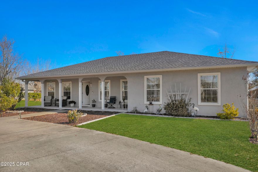 CHARMING HOME ON 1 ACRE CLOSE TO TYNDALL AFB. This spacious 1-acre property is conveniently located just 2.5 miles from Earl Gilbert Park near the Tyndall Bridge and 3.5 miles from Tyndall Air Force Base. Offering nearly 2,000 square feet of living space, this well-maintained home features 3 bedrooms, 2 bathrooms, open concept kitchen dining area and a separate living area with a split floor plan. The private primary suite includes a versatile flex space, ideal for a home office or hobby area, with French doors leading to a paved back patio and a partially fenced backyard—perfect for pets or outdoor activities. Recent updates include a new roof in 2018 and an HVAC system and water heater replaced within the past 2.5 years. Additional features include a large laundry room with exterior access to the side yard, a semi-circular driveway for easy parking, and three storage sheds for tools, equipment, or hobbies. All information is deemed reliable but not guaranteed; buyer to verify if important.