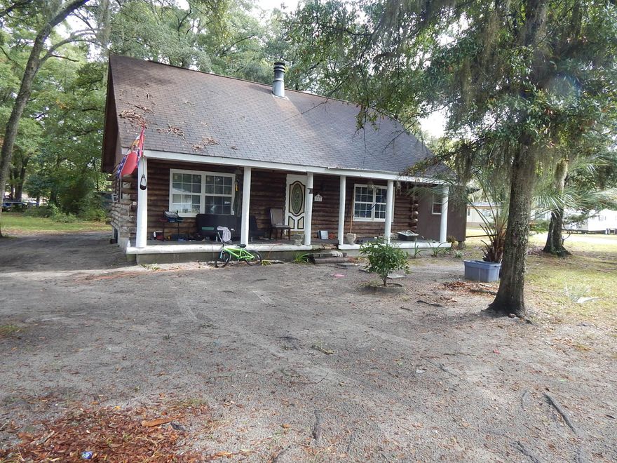 Quaint custom log home located on a large corner lot 150X110.  Hardwood oak floors throughout.  Bonus room added on. Home does need some work.  Central air needs repair.  At this price,  this home is an excellent investment.  Currently rented at $800 monthly. Home is walking distance from Callaway Public Boat Ramp.