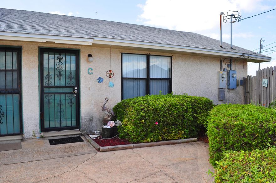 Just a block from Schooners Beach Club and beach access is where you'll find this single-story townhome! This is a 1BR/1BA unit being sold furnished.  The stove is new, the roof is only 6 years old and there is a privacy fenced yard with a sprinkler system.  Great weekend retreat or rental investment that's close to everything including the beach, the lagoon, marinas, St. Andrews State Park and so much more!  All info is approx and must be verified by Buyers if important.