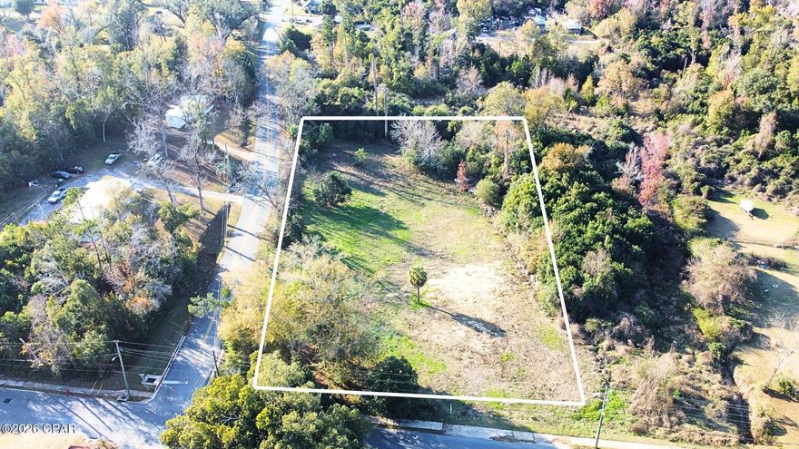 Very nice parcel with lots of paved road frontage in the city with city water and sewer available, multi-use property, for your business, apartments, duplex. Drive by and look at this property.