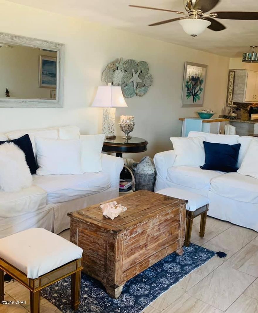 The sun sets right off your balcony over looking the Gulf with the most beautiful and vibrant water, skies, and sunsets. It's a rare 3 bedroom 2 bath that needs nothing. There are granite countertops throughout. The walk in shower is a huge bonus but has a tub and shower also. The light gray tile floors and light colors throughout give a warm and bright feel. Regency has 2 pools that are heated to enjoy year round. Hot tub, Tiki bar, large decks, with the white sand and surf as your back yard. This would make a great rental for investment or year round home. The gated community with security is a bonus and the HOA fees covers everything but your electric bill which averages about $100 per month. Cable TV, garbage pick up, water, grounds maintenance, pool maintenance, landscaping, and more are all covered in the HOA fees. Right around the corner are the marinas and this is the quieter side of PCB but close enough to get to everything in minutes. Very convenient location near Schooners and St Andrews State Park. The association runs a great program with strong financial reserves, low HOA fees, no special assessments due. 3 bedrooms are hard to find and this one should go fast so call today.