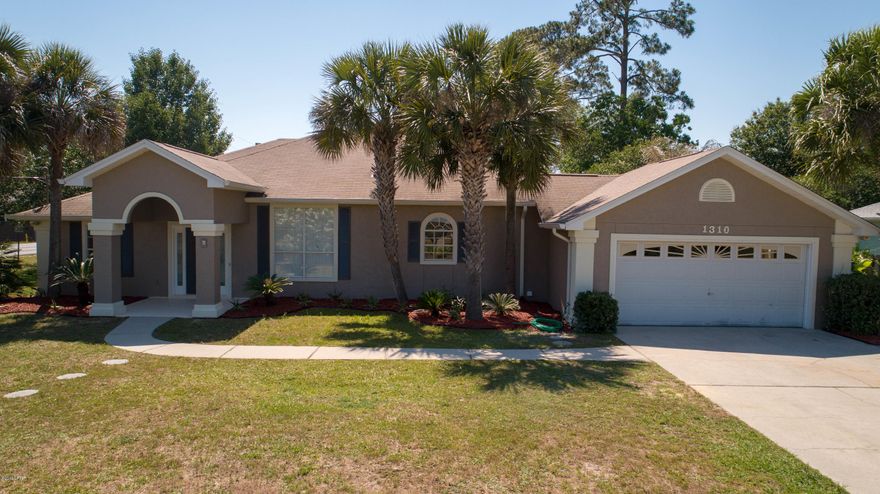 Completely renovated home with a pool in Lynn Haven! You will not believe this masterful renovation. Gourmet kitchen with a Thor Kitchen gas oven, wine fridge, stone back splash, and all new stainless appliances. This home boasts 5 bedrooms and an office! More than enough room for a large or growing family. All new rubbed bronze hardware & fixtures, vinyl plank flooring, and fresh paint inside & out. Sumptuous textures throughout this magnificent home. The garage has a workshop and restroom so you don't have to wander through the house when swimming in the pool. The tropical landscaping has mature fruit trees, jasmine, and many exotic flowers/plants. Huge 100ftx150ft corner lot in North Harbour, which is zoned for Mosley High School! Two street access with a concrete pad for a RV or boat. Did I mention there is a POOL!?! Beat the heat with this in-ground beauty.  Lounge in one of the two sitting areas or just splash until you can't move anymore! This home is priced to sell, so make your appointment today.