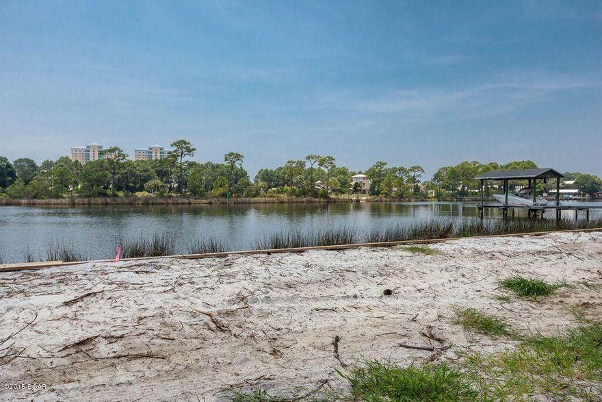 Buy this beautiful 100' water front lot on desirable North Lagoon and get a 4000 plus square foot home plan by the area's premier architect, J. Michael Hunnicutt.  This upscale plan was designed specifically for this lot which has large pines, scrub oaks and palmettos in the front area and scrub oaks and palmettos in the rear.  While walking the lot be sure and check out the new seawall.  Even the storm water culvert piping has been installed in the front of the lot to eliminate the drainage ditch.  This waterfront lot is ready for the construction of your new home and you will be ready to enjoy boating skiing, and fishing.  It is just a short boat ride to local restaurants and to Shell Island.  Call your realtor today to see the plans and survey of this property.  All information contained herein is intended to be correct, however buyer assumes complete responsibility for verification of all information.
