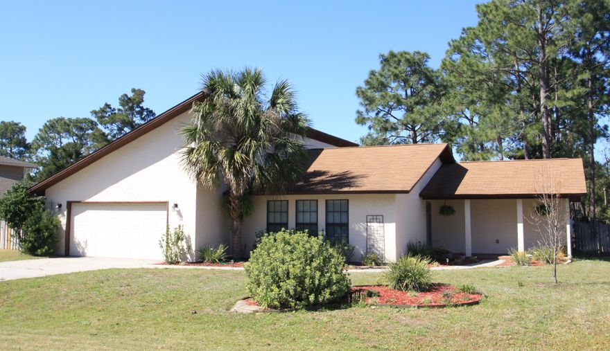 Very nice, well maintained home on canal in Northshore. Enter from the large covered front porch to the spacious foyer, adjoining the living/dining room. The well equipped kitchen includes tile floors, solid surface countertops, stainless appliances, pantry. The kitchen opens to a breakfast area & vaulted family room with fireplace. The split bedroom provides a spacious master bedroom with walk-in closet & en suite bath on one side of the home; 2 additional bedrooms, both with walk-in closets, & second bath on the other side. The family room & master bedroom open onto the light & airy Florida room. The double garage & ample driveway provide plenty of storage & parking. Sprinkler system & canopy on rear porch; rear yard provides ample space for fun, & canal access just beyond.