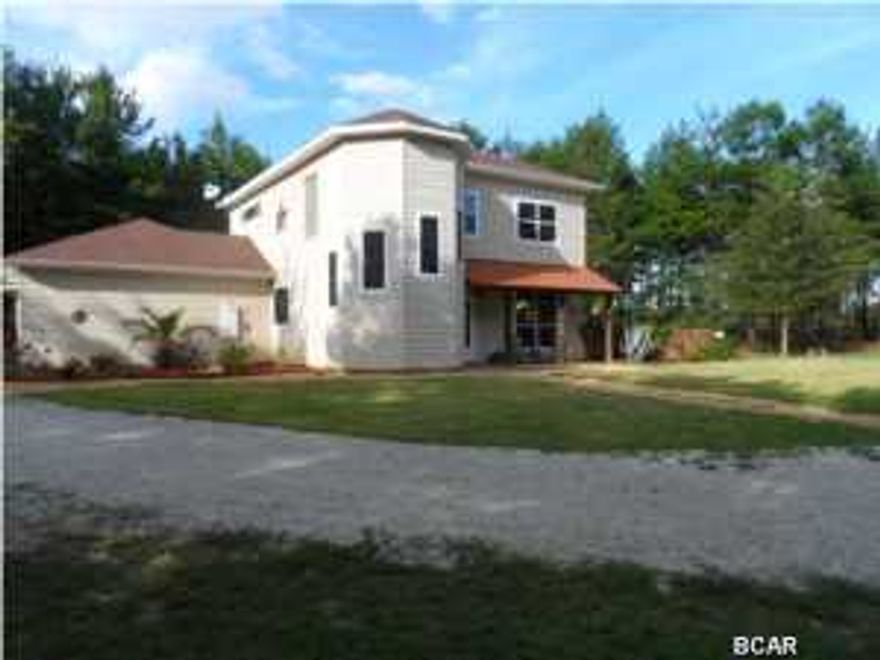 Looking for room to spread out and a quiet place to enjoy nature? Come Home to this 5+ Acre Country Estate , just a quick drive to town, the Airport and the Beaches. With over 3000 sq Feet of Living Space, there is room for everyone in this 4 bedroom Builder's Custom Home. The Living and Dining areas have warm tile flooring and neutral colors. Over sized windows let the Natural Light come in , making the spaces ''light and bright''. A Family Friendly Game Room gives that extra space for Movies, a Pool Table or Hobbies and is located just off the main living area. The first floor bedroom is perfect for guests or a home office. A dramatic staircase leads to the upper level and 3 bedrooms, including the Master Suite. You'll enjoy your own private retreat complete with its own Balcony an