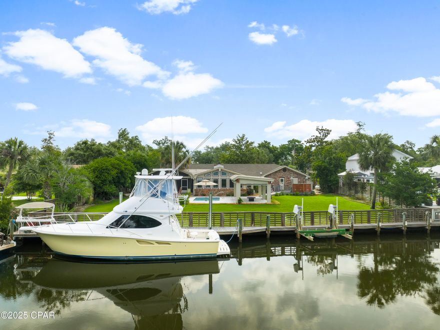 Tucked at the end of a quiet street in Baywood Shore Estates, this canal-front retreat offers the best of Northshore living: a private backyard oasis, deep water access, and no HOA restrictions. With 111 feet of canal frontage, a seawall, and a dock already in place, it's a boater's dream—offering seamless access to the bay, Intracoastal Waterway, and the Gulf beyond.

Inside, this thoughtfully upgraded single-story brick home spans over 3,200 square feet, delivering comfort and functionality at every turn. The spacious living room, anchored by a wall of windows and a built-in 60-inch TV, opens to the screened porch and pool area, providing serene water views and effortless indoor-outdoor flow. At the heart of the home, the chef's kitchen features a commercial-grade 60'' FiveStar double oven range with grill, double refrigerators, and a built-in Hoshizaki undercounter ice machine—ideal for entertaining. The adjacent dining room offers plenty of space for gatherings large and small.

Three bedrooms and two baths include a generous primary suite with a custom walk-in closet, spa-style bath, and steam shower. Additional highlights include a dedicated home office, game room, a temperature-controlled tackle room, and custom blinds throughout. A whole-home water treatment system ensures quality and comfort at every faucet.

Outdoors, the concrete pool, pergola, and fire pit create a stunning focal point, while the summer kitchen—featuring a Blaze grill and Primo smoker—sets the stage for unforgettable alfresco dining. The home is equipped with hurricane-rated windows and doors, a whole-home generator, and an owned 500-gallon propane tank (not leased). The new roof, installed in May 2025, includes a 50-year transferable warranty.

Whether you're cruising the bay, cooking for a crowd, or enjoying a quiet sunset from your private dock, this meticulously maintained residence captures the essence of laid-back coastal living. For those seeking the complete waterfront lifestyle, a 39-foot Tiara Yacht is available through a separate bill of sale.