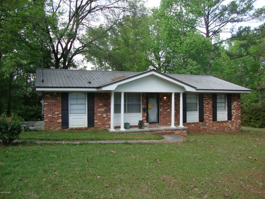2 bedroom 1 bath Brick home on corner lots in small town of Bonifay, Florida.  Originally was a 3 bedroom but converted but could be changed back. Even has a large unfinished room that could be another bedroom. Metal roof. Bamboo wood floors throughout.  Large deck on the back. Storage Building. Walking distance to shopping. Nice and quiet street.