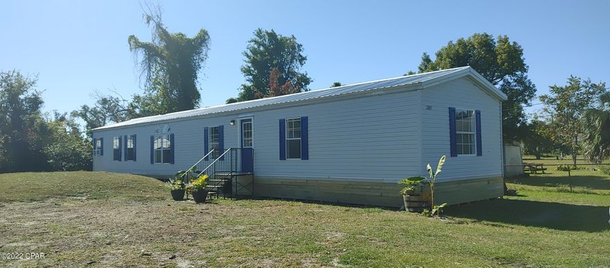 ATTN: Investors- Location is the key and minutes away from the Beaches & All Amentities.  This 3bedroom 2 Bath has had a complete remodel on the inside including freshly painted, vp flooring, new lighting & bathroom fixtures tv cable ran through walls.  New roof 7/30/2021, septic tank inspectin & clean out.  Primary Bathroom has dressing area, walk in shower and walk through closet offset to a spacious Primary bedroom.  Has a good tenant in place and produces a good return on investment.  Property is currently under Property Management & lease will be honored with purchase.  Pictures reflect condition of home and no furnishings are included in purchase.  Don't let this one slip away as the location makes it a perfect investment property.