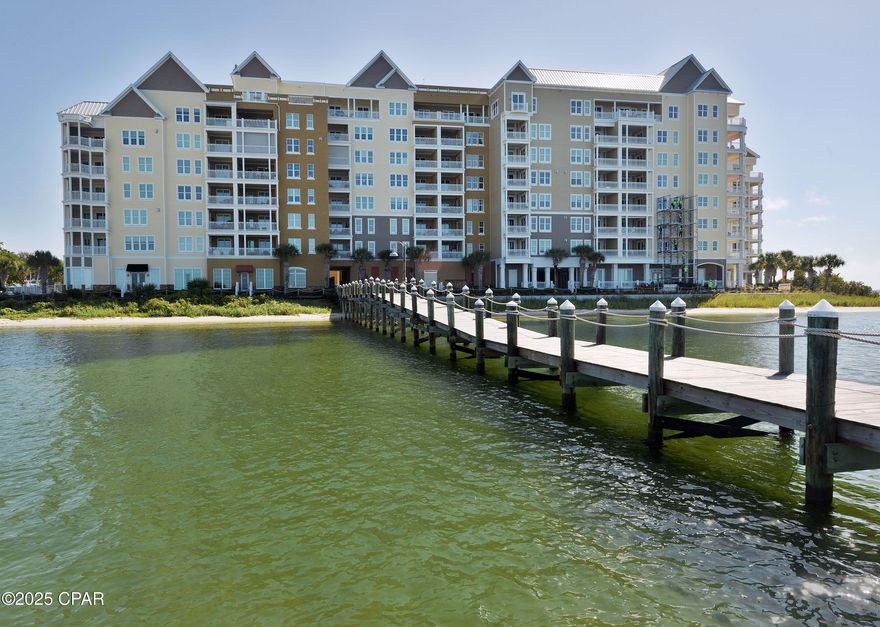 Bring an offer, seller is motivated. A rare opportunity to own on the top floor in Harbour Village! Discover an unparalleled coastal lifestyle in this exquisite 3-bedroom, 3-bathroom Bayfront condominium at Harbour Village, a prestigious gated community in the heart of Historic St. Andrews—a place residents proudly call home! This top-floor residence boasts soaring 11ft ceilings and over 2,000 square feet of thoughtfully designed living space. Revel in breathtaking views of St. Andrews Bay, Shell Island, and the Intracoastal Waterway from the master suite, living area, dining room, and kitchen. Watch boats glide by and dolphins dance from the comfort of your private balcony. The open-concept layout features a gourmet kitchen with sleek stainless steel appliances, granite countertops, a spacious breakfast bar, and ample cabinetry. The updated laundry room includes a tankless water heater, luxury vinyl plank (LVP) flooring, new cabinetry with quartz countertops, and convenient pantry shelving along with a commercial ice maker. Unwind in the expansive master suite, complete with a charming window seat offering additional storage. The luxurious ensuite bathroom features a double vanity, a soaking garden tub, a tiled walk-in shower, and a generous walk-in closet. The second bedroom includes a private ensuite with a shower/tub combo. Elegant crown molding adorns the entire unit and modern lighting fixtures enhance the entire unit all updated in 2024. Harbour Village offers an array of premium amenities, including a heated waterfront pool with bay views, a state-of-the-art fitness center, a grand clubhouse, a private community park with a garden, a covered parking garage, an outdoor fireplace with a cozy seating area, and a grilling gazebo. Just steps away, Historic St. Andrews beckons with its vibrant marinas, top-tier restaurants, scenic waterfront parks, and unique boutique shops. Whether you're boating, dining, or soaking in the scenery, this condo places you at the center of it all. Seize this rare opportunity to own a slice of coastal elegance and modern sophistication in one of Bay County's most coveted communities. Schedule your private tour today! Large boat slip with 12,000lb lift can be purchased separately. Deeded 10x5 climate controlled storage unit is included in the sale.