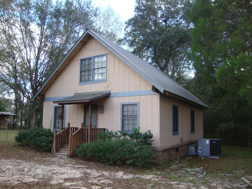 Bring the Horses. Cute as a button is this 3 Bedroom 1 Bath 2 Story Frame home on 2 Acres. Ground floor has open floor plan consisting of the living room, dining room and kitchen with an inviting fireplace in the center. Master Bedroom and spacious bath is located on the ground floor with the other 2 bedrooms upstairs. Great views from the kitchen as you look out thru the screened back porch. Detached 2 car carport and a spacious outbuilding with water, electric and a cozy porch. Nice 2 stall horse barn with hay storage area and feed/tack room. 12' X 12' concrete slab on the east end of barn ready to add on. Nice Pasture fenced and cross fenced. Small pond. Composting area. Variety of fruit and nut trees. Deeded easement provides long driveway back to the property.