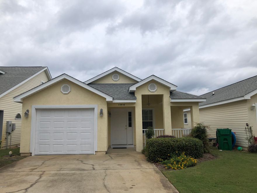 Spacious three bedroom two bath home centrally located in the Palm Cove subdivision on Panama City Beach.  This home is in the best location in Palm Cove.since it backs directly up to the swimming pools, it has extra parking in front and the entrance of the street is closed from dusk until dawn.  This home is in good condition and move in ready. Home features large kitchen, tile floors, oversized mater bath with double vanity, single car garage and screened in back patio. Palm Cove has two pools and is centrally located to many beach amenities. HOA fees include lawn maintenance and security at night.  Call to see today before its gone.