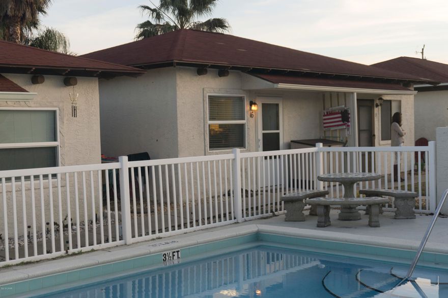 JUST LISTED !! Welcome to this quaint community with only 23 units! This updated 1 bedroom unit is located just two blocks from beach access 9.  Low HOA fees at just 122 a month! There is a pool located conveniently in front of the unit. Stainless steel appliances and updated floors make this unit great for a primary residence or a beach home.  If you have been looking for primary or secondary beach unit for under !100,000 with low HOA fees, THIS IS IT!