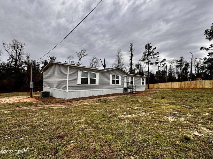 Brand new 4/2 manufactured home located on a half acre in town in a quiet community. Everything is brand new here and ready to move in! Open floor plan living area with a large dining room. Kitchen features all new appliances and an island.  Will qualify for all type financing.   Make an appointment to see it today!