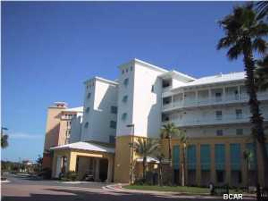 This is a top floor unit - freshly painted - in great condition. The carpeting has been replaced with tile floors. It is a one bedroom, 1 bath unit with separate sitting area and efficiency kitchen. The balcony has ample room for table and chairs and a chaise longue. The views from this unit are quite spectacular - overlooking Lake Carillon and the Gulf of Mexico. As an owner of this unit, you are a part of the community of Carillon Beach and, as such, are entitled to use all of the amenities - four swimming pools, hot tubs, play grounds, tennis courts, basketball court and over 3,900 front feet of sandy sugar beaches with eight access walkovers.