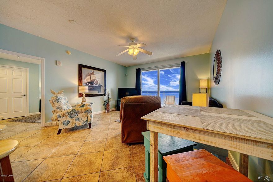 Fully furnished, Gulf front 2 bed, 2 bath condo at the desirable Sterling Reef Condos. This unit features an open living room, dining area and kitchen floor plan, making hosting a breeze. The open living room offers a stunning view of the water while relaxing indoors. The sliding glass doors in the living room lead to the private balcony overlooking the Gulf of Mexico, allowing you to immerse yourself in the warmth and serenity.  The kitchen has plenty of cabinet space for storage, granite counters, and a kitchen island with a breakfast bar. The spacious master bedroom also offers direct views of the Gulf and also has sliding doors leading to the balcony. The private master bathroom features a shower/tub combo, linen closet and a large vanity. The guest bedroom is split from the master, offering plenty of peace and privacy. The guest bedroom has its own guest bathroom also with a shower/tub combo. There is a lock-out owners closet for additional indoor storage. This unit has been tastefully decorated with beach décor that will convey as well as the washer/dryer. Sterling Reef Condos features a pool, hot tub, exercise room and more. This complex is just minutes away from Pier Park, Shipwreck Island and local Gulf front restaurants for plenty of family friendly atmospheres.