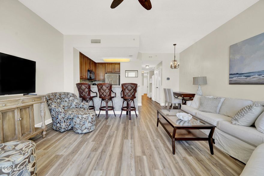 ''CURRENTLY UNDER CONTRACT, SELLER WILL CONSIDER BACKUP OFFERS'' Beautifully Updated and Rarely Available - this unit includes a DEEDED STORAGE ROOM! This stunning second-floor Seychelles Resort Condominium is a true gem - newly furnished and freshly updated with new HVAC, this unit provides the best of both worlds, elevated panoramic gulf views, easy access, and all the convenience you need for resort-style living. Inside, you'll find high ceilings and ample natural light, freshly painted walls, and brand-new luxury vinyl plank (LVP) flooring throughout. With 883 square feet of open-concept living space, access your private balcony and enjoy the breathtaking view through the expansive sliding glass doors from the living area. 
The energy-efficient kitchen boasts stainless steel appliances, including a new stove and dishwasher, designed to save you both time and energy. The spacious master bedroom features a cultured marble private ensuite, enhancing the flow of the space and offering both comfort and style. Perfect for families, the bunk room functions like a second bedroom, providing extra space for children or guests. The hall bath boasts a marble style shower with a glass enclosure, perfect for guests and everyday use. Enjoy the ease of an in-unit laundry with a brand new stackable washer and dryer.  Seychelles is one of the few resorts where electricity is included in the HOA fees.  The HOA fees cover all utilities, including ELECTRICITY, cable, internet, water, and sewage. Resort-style amenities include two Gulf-front pools with hot tubs, beach access, a fully equipped gym, a community room, and gated garage parking. Plus, you're just steps away from iconic Schooners Beach Club and just a short distance from St. Andrews State Park. Nearby you'll find other favorite destinations and renowned restaurants. Whether you're looking for EXCELLENT RENTAL INCOME POTENTIAL,  a permanent residence, or a personal getaway, you'll fall in love with this beautiful condo. Act swiftly and seize this opportunity before it's gone.  Schedule your showing today!