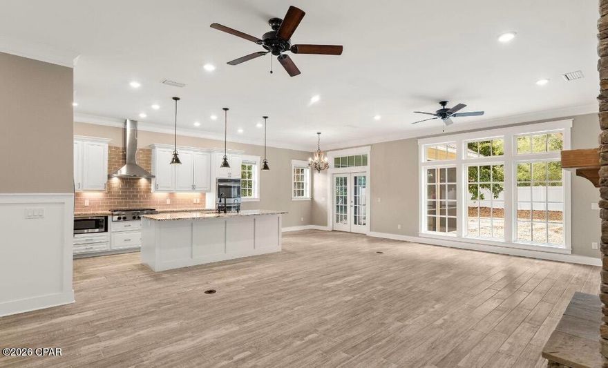 ADDITIONAL PHOTOS COMING VERY SOON. Wonderful opportunity to live just minutes from the World's Most Beautiful Beaches and steps from St. Andrews Bay. 5 miles from St. Andrew State Park and numerous other Public Beach Accesses, this Spacious, Custom Coastal Cottage Style Home is tucked away on a lot overflowing with Spanish Moss draped Live Oaks, Crepe Myrtle's, and Wild Magnolia Trees. Bright and airy, open floor plan 4 bedroom, 3 bath home is just under 2600 ft, HOME IS MUCH, MUCH MORE SPACIOUS THAN IT APPEARS FROM EXTERIOR PHOTOS and is beautifully designed with 10-foot ceilings throughout, tall crown molding & baseboards as well as other beautiful wood trim. Situated on the lot to offer the perfect amount of privacy in an amazing area surrounded by Saint Andrews Bay and Grand Lagoon. Grand Lagoon can be seen through the breakfast area windows and from the screened porch. Just a quick walk from the driveway will lead you to one of the best accesses to Saint Andrews Bay where you may launch your canoe, kayak, or paddle board. You can also see Shell Island & Saint Andrew State Park from this point. A very short distance to many public beach accesses to the Gulf-home of the World's Most Beautiful Beaches. The split bedroom floor plan features a large master suite,with its own wing of the home and a walk-in closet as large as many bedrooms. In addition to large double vanity, linen closet, and linen cabinet, the master bath offers a large walk-in shower with bench, two stationary shower heads and one mobile shower wand. All bedrooms are oversized. Everything in this is home was built with comfort in mind. Gourmet dream kitchen with huge island overlooks spacious family room with wood fireplace flanked on either side by large built-in bookcases. Kitchen includes built-in gas cook top, double wall ovens in addition to a microwave, two dishwashers and an enormous walk-in pantry. Very large laundry room with built-in laundry sink, loads of shelving, cabinetry and hanging space. Enjoy a relaxing evening on the front porch swing or the view of Grand Lagoon from the screened porch, strategically placed so that it does not block sunlight coming into the living area. Home features an unbelievable amount of storage space and two gas tankless water heaters so you'll never have to wait for or run out or hot water. Expanded two car courtyard entry garage with extra space for storage. Fenced back yard. Lawn weed control and pest control provided. 1 -2 dogs negotiable with owner's approval. $500 pet deposit. Measurements are approximate. Square footage per floor plans. Security cameras are in use and will be removed once rented. Owner is a Licensed Realtor acting as Rental Agent & Rental​​‌​​​​‌​‌​​​​‌​​‌​​​​‌‌ Manager.