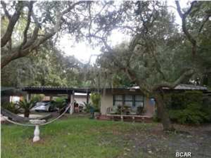 Sprawling Ranch Home -- Florida-style... with live-oak and spanish moss trees, landscape is basic, looks nice but not much to manage! Very large pole barn for storage, workshop, garage use for the do-it-yourselfers (DIY's) also those small businesses that need this type of space and location, meets county code for such! Home needs some TLC but is well suited for the busy family concept or entertaining friends, situated on two lots near the Bay with Bay access, seller wants it GONE. Easy to show! no foreclosure, seller will entertain all offers. SELLER can assist with your expenses for closing (almost No Money Down Deal!) with your accepted offer. Call for details and its easy to show!
