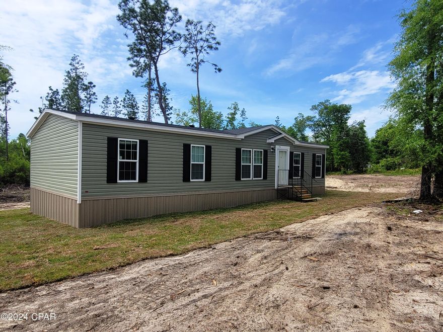 Check out this beautiful 2024 three bedroom, two bathroom manufactured home located on 1+/- acres.  Large living area with open living room, family room and kitchen.  The family room has a beautiful built in fireplace. Home will be ready to show within the month.  Sellers are in the process of putting in the finishing touches.