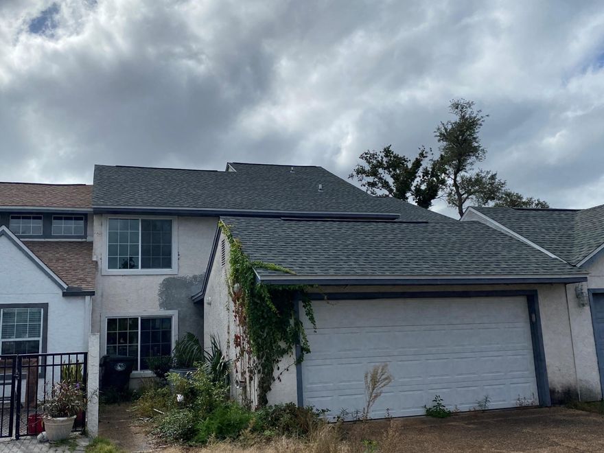 Large 3 bedroom 2 bath town home on the 6th hole in the Lynn Haven Country Club. Home was damaged in hurricane and some drywall has been replaced.  Unit features large closets, high ceilings, kitchen and breakfast room and large living area. Two car garage and two a/c's. 

Please enter with caution. 

Buyer to verify all measurements.