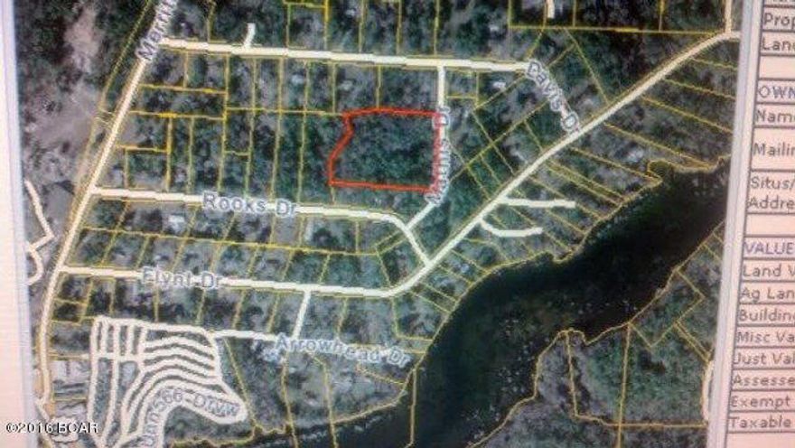 LARGE 5.4 ACRE HOME SITE NEAR TOWN with OWNER FINANCING! This is the perfect place for your new home, or for a home contractor wanting a large tract to build several homes on near Marianna, that is already subdivided! This attractive property is located in a beautiful community of nice homes, just East of Marianna, near Merritts Mill Pond and Blue Springs. The property even has it's own spring fed creek on the rear border, where it adjoins another vacant parcel for sale also. You could combine the two properties and have over 7.5 acres right next to the City. Room to hunt, fish and explore, or just clear an acre for your new home, and enjoy the serenity of nature in a park like setting!