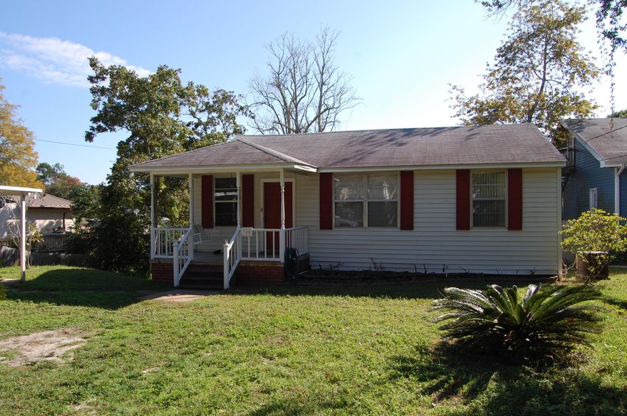 Age, sq.ft, lot and room sizes are approximate. Located in a lovely neighborhood close to downtown shopping, hospital and schools. Original hardwood floors throughout most of the house. Alley access to rear of house. Storage shed stays. Large backyard. Move in ready.