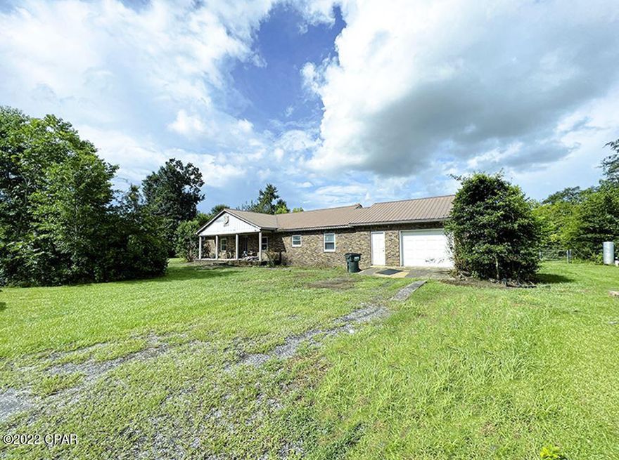 This home is a ''fixer-upper's'' dream. This large brick home offers 4 bedrooms, 2.5 baths, attached garage, 20x40 in-ground pool with a large covered area for entertaining. The property provides sought after privacy with a wooded barrier around the entire parcel equipped with a storage shed. The gravel driveway leads you to a large front yard. As you transition to the back of the property, there's a producing pecan tree and a well manicured, but secluded, pasture behind the home with endless opportunities. The home offers large storm windows, french doors, custom kitchen cabinets, a butler's pantry, wood burning fireplace, bay windows overlooking the pool and a dreamy pool view from the master bedroom. You will have the luxury of private country living, all while being 5 miles from town.