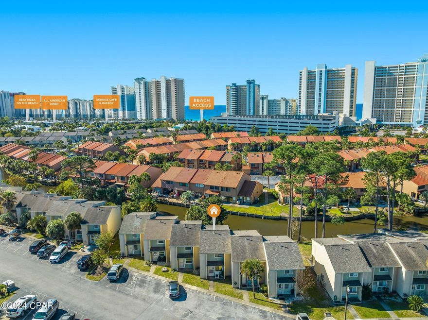 Back on the Market-  no fault to the seller!!
CANAL FRONT property in the Heart of Panama City Beach!  Check out this 2 bedroom 2 bath townhome in Gulf Highlands!  You will find peace & relaxation in the canal front backyard with plenty of shade.  A screened in back porch offers shelter & privacy to enjoy the view in any weather!  Inside, the kitchen has been remodeled with new cabinetry, countertops & appliances.  Upstairs, bamboo covered floors in both bedrooms. Perfect for a vacation rental investment property or second home!  Call today for a private showing!  All measurements are approximate.