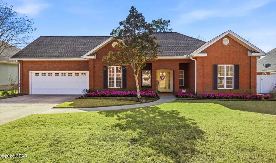 Gorgeous Hammock's brick home filled with warmth and elegant details including wide crown molding, tray and cathedral ceilings, and a stunning floor-to-ceiling stone fireplace visible from the foyer. Spacious kitchen features updated cabinets, modern hardware, and granite countertops. Large primary suite offers a tiled shower, Jacuzzi tub, granite double vanities, and generous closet space. Upstairs suite is ideal for guests, or relatives.  Enjoy the screened porch with access from the kitchen and primary bedroom, leading to a landscaped, fenced backyard. Split bedroom plan, ample storage, spacious garage, sprinkler system, surround sound wiring, and alarm system.