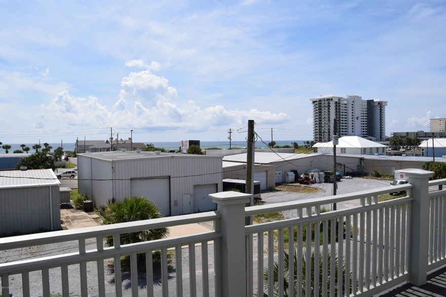 What a great beach house! Three stories with a covered patio in the front and in the back, and a balcony on the second and third floors on the front of the house and another balcony on the second floor at the back of the house! Enjoy gulf views from the balconies! Walk just 2 blocks to wiggle your toes in the sand! The spacious, open living room has French doors leading out to one of the balconies. This large home has 4 bedrooms and 5 bathrooms. Every bedroom has a bathroom en suite! Think of the rental possibilities!  The deep back yard has a privacy fence and the roof is metal.