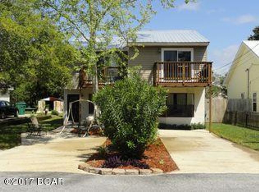 Well maintained townhome located on the most sought after end of the beach west of highway 79. Short walk to beach and 5 minutes to Pier Park and 5 minutes to Walton county. Each side has 2 bedrooms and a full bath upstairs with a balcony off the master bedroom. Downstairs living/dining, half bath, kitchen with walk in pantry, laundry room and sun room with pass through bar from kitchen. Deck off the sun room. Metal roof put on 2012, septic system put in 2010, remodeled 2009, new front doors and upstairs sliders 2015, new shed, new water-heater, fresh paint 2016. In ground sprinkler with timer, privacy fenced. Very well maintained home. No HOA. Both units currently rented at $1350 per month and tenants pay all utilities. These units are immmaculate and income producing. Live in one side nd rent the other. This unit is on the south side of Panama City Beach and walking distance to the beach. Great beach rental, long or short term rental allowed and no HOA fees.