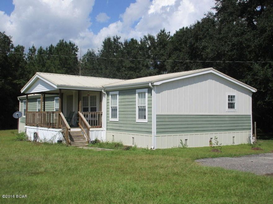 Spacious 4 bedroom, 3 bath home… Large living room has a wood burning fireplace…  Kitchen has lots of cabinets that feature appliance garage & lazy susans in the corner cabinets… Crown molding throughout… Split bedroom floorplan… Master suite has walk-in closet, double vanity, garden tub with separate shower… Two bedrooms have Jack & Jill style bathroom… Large covered front porch & large back deck… Storage building… This place has been well maintained and is move in ready!