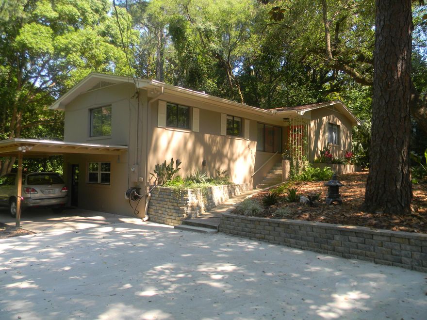 COASTAL COVE Charmer - COMPLETELY RENOVATED 2015/16 -  

Fabulous, directly across from Massalina Bayou with boat slips for rent !! MOVE IN READY - nice double lot w/heritage oak trees, fruit trees and organic raise bed gardens -  WALK TO THE WATER! Home sits high & dry.  

This AMAZING vintage cottage has ALL NEW roof, HVAC, paint inside & out, cabinets, granite, appliances, gas fireplace,  some new windows, concrete driveway, stone retaining wall, landscaping, gutters,blinds & more!  Over $50,000 in upgrades all for you.  Carport and utility room - new expanded driveway ready for a double garage and your boat! HUGE back deck for entertaining. All appliances convey including front load washer & dryer.  Must see to appreciate - Priced to Sell - Owner relocating.