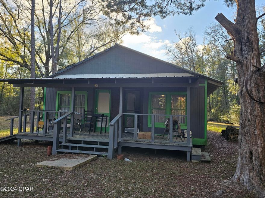 The ultimate in country living awaits you with this private 1 acre lot with a quaint Florida cottage home, less than 1 mile from Porter Pond, with boat ramp. Deer, turkeys, and other wildlife LOVE your property! Home has been rewired, ~2019, and has a newer metal roof, ~2019. New well pump 2023 Large storage building in the back yard. When seller leaves in the next day or so, what you see left conveys. A little bit of your TLC will make this property a very special place to call home. Call your favorite Realtor RIGHT NOW and schedule to see this home! NOTE: SELLER HAS HAD SEVERAL INSPECTIONS AND WITH AN ACCEPTABLE OFFER IS PREPARED TO COMPLETE ALL REPAIRS REQUIRED FOR A LOAN BUYER TO OBTAIN A HOMEOWNERS INSURANCE POLICY!
