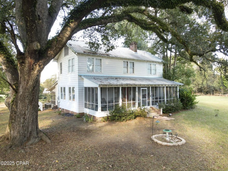 This 4 bedroom 2 bath historic home, built in 1945 in Greenwood, Florida has been lovingly maintained for all 8 decades of its life.  Charm abounds inside and out.  The  home shares the 2.6 acre lot with majestic mature oaks that make lounging on either of the two large screened porches seem like a scene from a southern love novel.   Inside awaits 2248 square feet of living space boasting beautiful original hardwood floors and molding, cedar-lined closets, and solid wood 5 panel doors with original antique hardware.  The primary bedroom and one bathroom are conveniently situated on the main floor while the other three bedrooms and one bathroom are located upstairs. The local grocery store is just 0.2 miles away and the Marianna schools and recreation facilities are about a five mile drive away.  This kind of home is rarely up for grabs!  Don't miss out!  Book a tour today!