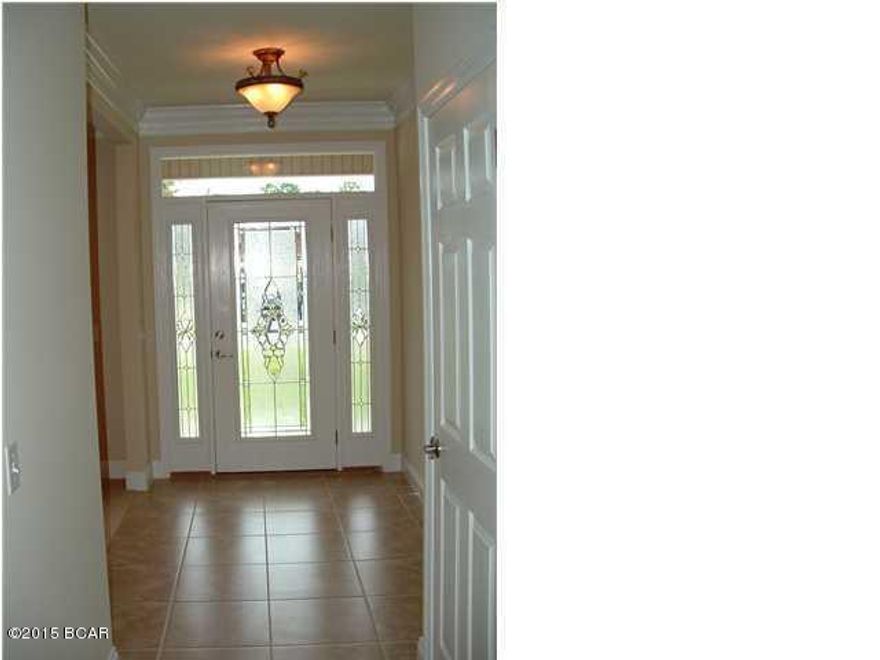 Beautiful brick home in Hillcrest subdivision.  It welcomes you with a 32' x 7' front porch, its elegant white colonial style columns, and dormer windows accenting the front of the house. Extra touches throughout, such as; extra insulation between the master suite and the oak stairwell to the upstairs bedroom for less noise, and the separate energy efficient central a/c unit w/remote control in the upstairs bedroom over the garage. The heating and cooling system is 14 seer heat pump. The main living areas are open and flow nicely for entertaining. The Kitchen hosts Corian countertops accentuated by a travertine backsplash, custom maple cabinets 16'' tile flooring.  There is a screen in back porch, and an open deck area off the screened porch, overlooking a large privacy fenced backyard. La