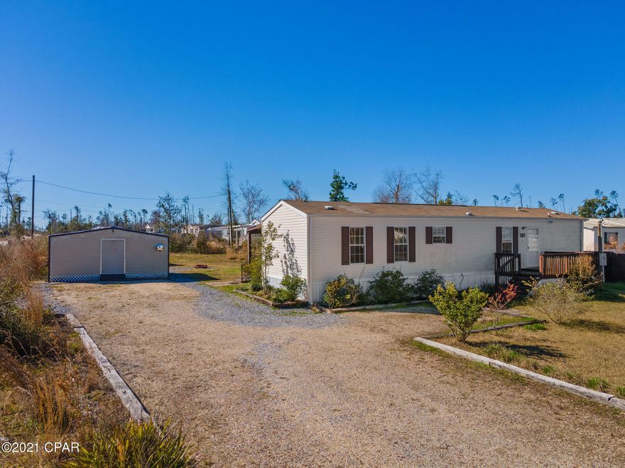 Well-Kept, Affordable home on a little over half an acre! You will love the layout of this home; with spacious bedrooms on each end of the house and an open concept in the living area. ''His and Her'' vanity in the Master Bathroom along with ''His and Her'' closets in the Master Suite. Not only do you have a front porch but a covered back porch as well! The property also includes nice size sheds for all of your tools and projects! This home is not going to last long, call today and set up your showing!