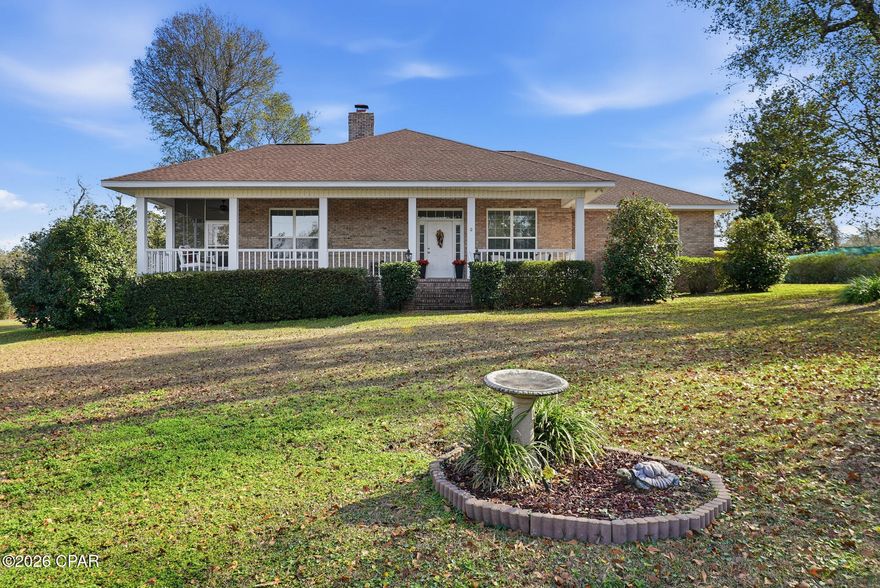 OPEN HOUSE SUNDAY JAN 18th,1-3:00 PM COME HOME to BEAR CREEK and this 2.6 acre estate featuring 5 bedrooms, 3 baths and a charming country lifestyle! With over  4000 sq feet under roof, you'll be assured of all the space needed for comfortable living. 
The classic brick exterior and wrap around front porch welcome you inside. An open floor plan offers spacious living and dining areas highlighted with a brick fireplace, beautiful LVP FLOORING and warm architectural accents. 
A convenient breakfast bar connects the updated kitchen with the living areas and features QUARTZ COUNTERS and STAINLESS APPLIANCES. A large BUTLER'S PANTRY adds loads of storage, extra counter space, a second sink and refrigerator. 
The master bedroom is tucked into a quiet corner for extra privacy. The master bath is a luxurious retreat with a large soaking tub and a huge walk in shower. 
There are 3 additional bedrooms that share a full bath and a separate suite that is perfect for guests, older children or as a Mother in Law space. It also includes a kitchen and a private screened porch. 
The outside offers several covered porches, a custom above ground pool with decking, a pole barn and hook up for a motorhome. Plus loads of space for all your outdoor activities! The property extends from street to street with rear access offering additional development possibilities. NO REQUIRED FLOOD  INSURANCE and NO HOA's!